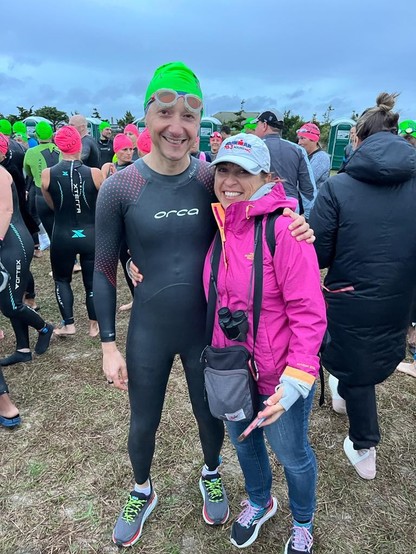Me in my wetsuit and green cap, almost ready for the swim. My wife with her pink jacket more anxious than me