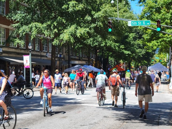 Streets opened up to the public to walk and cycle. Lots of trees and greenery.