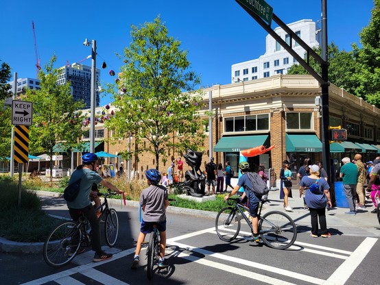 Streets opened up to the public to walk and cycle. Lots of trees and greenery.