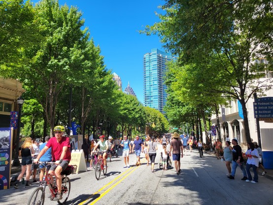 Streets opened up to the public to walk and cycle. Lots of trees and greenery.