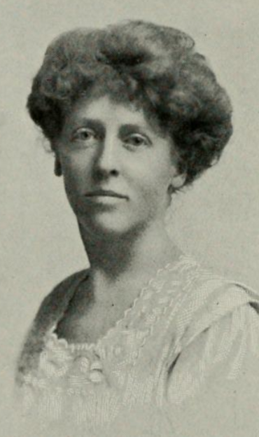 Lina Drechsler Adamson, from a 1912 publication; a white woman with hair in a bouffant updo, wearing a white lace-trimmed blouse or dress