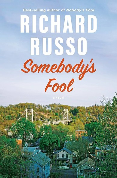 Book cover:
Photograph of a small town with clapboard houses & a suspension bridge partly obscured by mature trees. In the pale sky above, the text:
Richard Russo
Somebody's Fool