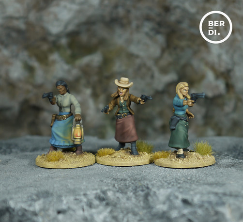 wargames models. Three female gunslingers. all carry six-shooters, one holds a lantern. All are dressed in long dresses in muted colours - pales blue, grey, mid-brown, green.