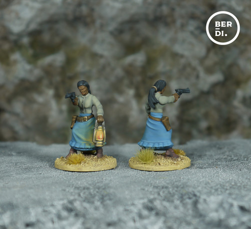 wargame model. Female gunslinger. She wears a grey shirt and a light blue dress. She holds a lantern and is aiming a six-shooter.