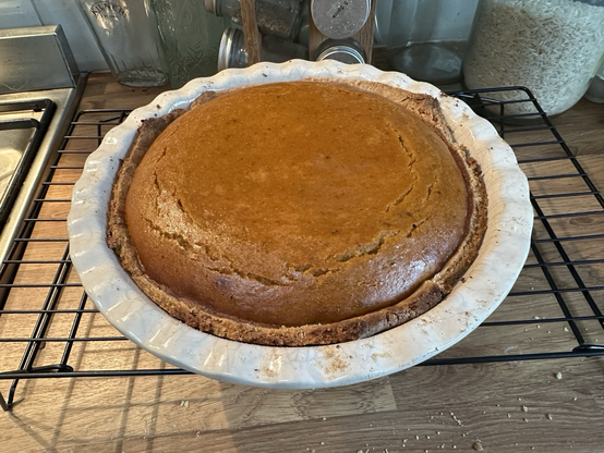 Photograph of a whole, home made pumpkin pie