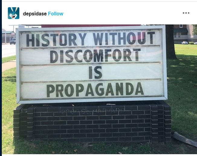 Posted sign photographed by depsidase "HISTORY Without DISCOMFORT is PROPAGANDA"