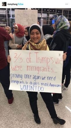 Post from its my thang:
Immigrant woman holds a sign reading:
