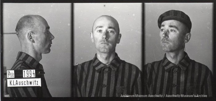 A mugshot registration photograph from Auschwitz. A man with a shaved head wearing a striped uniform photographed in three positions (profile and front with bare head and a photo with a slightly turned head with a hat on). The prisoner number is visible on a marking board on the left.
