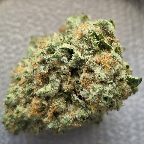 A close up of a bud of Candy Fumez