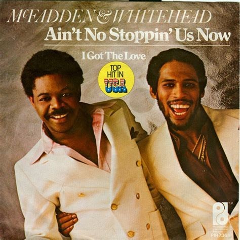 Album Cover. Top of cover text:
McFadden & Whitehead
Ain’t No Stoppin’ Us Now
I Got The Love
Both men are in cream colored suits, leaning to the left with smiles on their faces. 