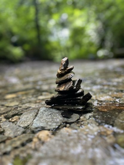 Photo of a zen stone stack taken at the peaceful St Nectans Glen in Cornwall 