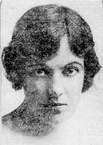 Nena Blake, a young white woman with dark hair parted on the side