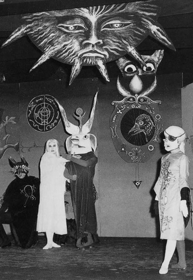 100 days until Halloween 

picture is of two men wearing Halloween masks and two women in blonde wigs, one of whom is wearing an eye patch ~ in addition, there is a painted backdrop with some fake looking occult symbolism ~ the picture was sourced from Pinterest there was no accompanying information