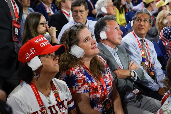 maga people at rnc wearing ear bandages and smiling beatifically