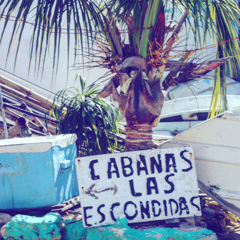 “Cabanas” sign by palm trees