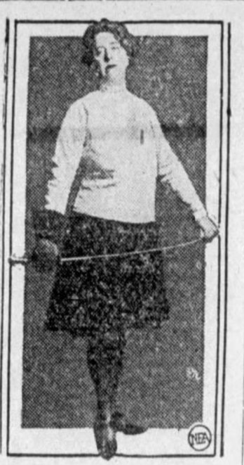 Eleanor Baldwin Cass in fencing clothes, holding a fencing pose