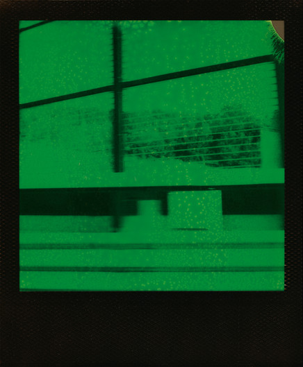 Polaroid Duochrome Black and Green of lines and shapes as seen while traveling on my passenger seat.
