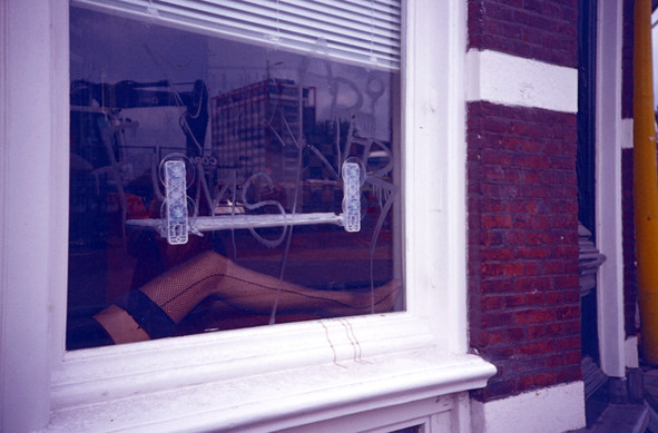 A window in Amsterdam, with the superimposition of what's inside and what's reflecting on the glass. Shot on 35mm expired Kodak Ektachrome 100VS analog film with a Lomo Lc-a camera.