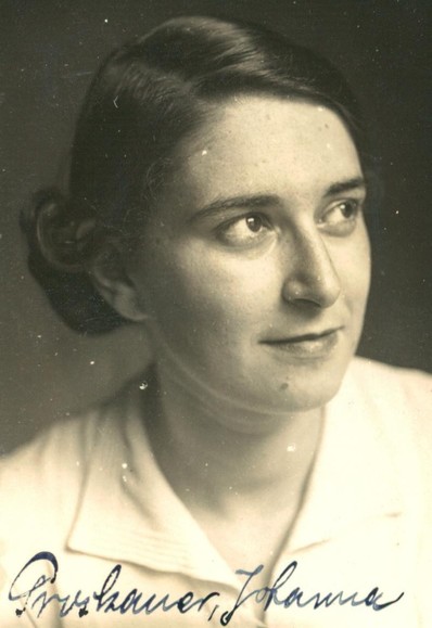 Black and white portrait of a woman with a calm expression, looking slightly to the right