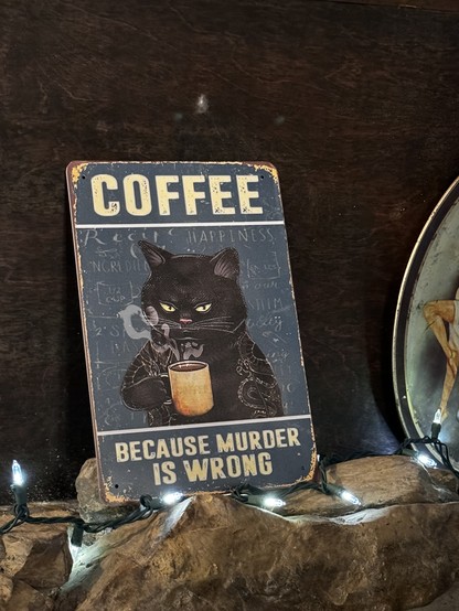 Sign says “coffee before murder is wrong” 