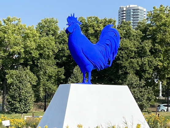 Big blue chicken on a pedestal 
