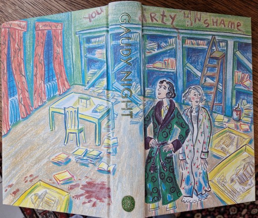 View of the opened cover of 'Gaudy Night' by Dorothy L. Sayers. It shows two women looking at a trashed library.