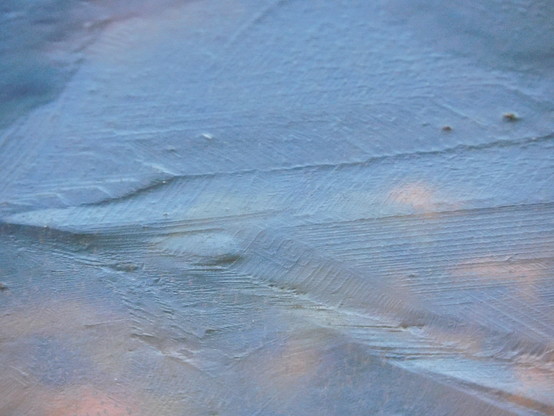 Close-up of ice on the frozen birdbath.