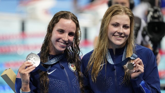 Silver medalist Regan Smith, of the United States, right, and bronze medalist Katharine Berkoff, of the United States, pose for a photo following the women's 100-meter backstroke final at the 2024 Summer Olympics on Tuesday, July 30, 2024, in Nanterre, France.