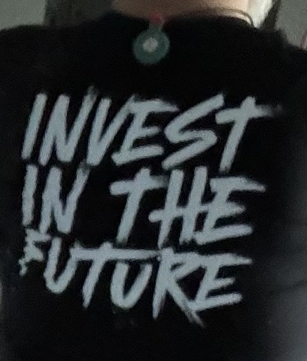 Invest in the Future on back of tshirt.