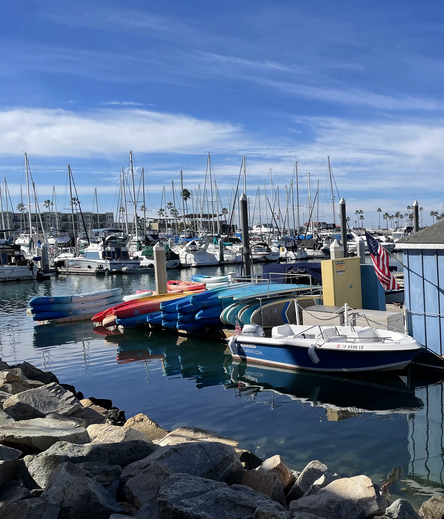 Small harbor scene with colorful kayaks 