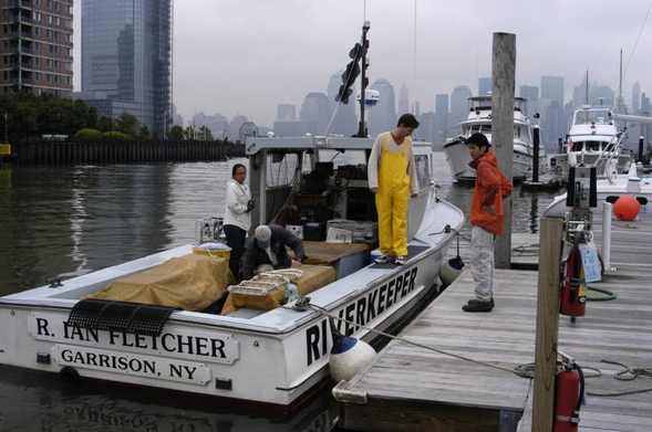 A group of people working on a boat named 