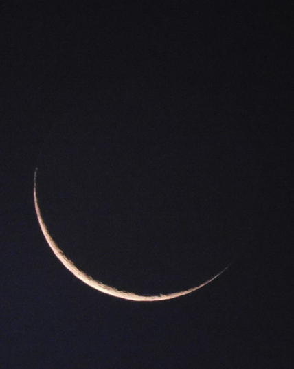 Sliver of a recently new moon.