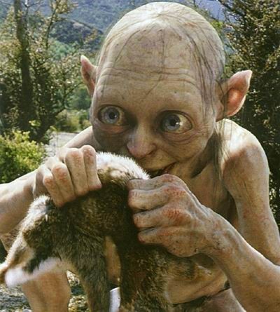 Gollum from Lord of the rings holding a half eaten raw dead rabbit