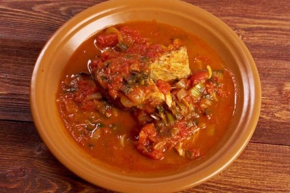 A plate of hrime, a Libiyan fish dish.