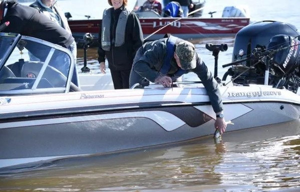  Vice presidental nominee releasing a walleye.