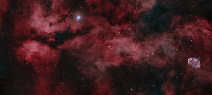 Astrophoto of Butterfly nebula and Crescent nebula with crimson wave structure from Hydrogen Alpha light.