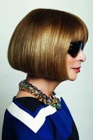 Anna Wintour in profile with her famous bob and sunglasses 