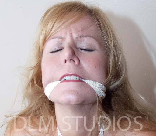 Close of of a cleave gagged blonde.