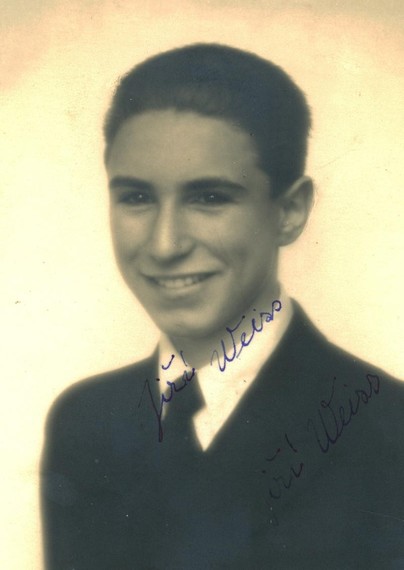 Vintage black-and-white portrait of a smiling man in a formal suit.