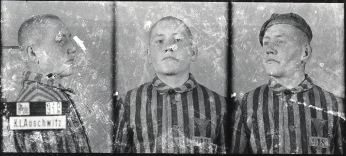 A mugshot registration photograph from Auschwitz. A man with a shaved head wearing a striped uniform photographed in three positions (profile and front with bare head and a photo with a slightly turned head with a hat on). The prisoner number is visible on a marking board on the left.