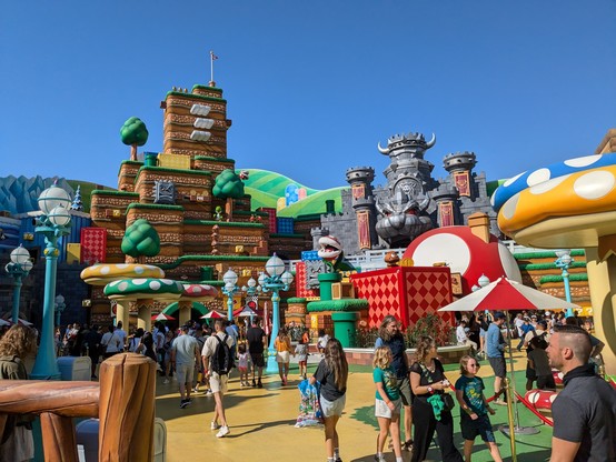 Mario area of Universal featuring gaint mushrooms, a mountain with moving platforms, and Bowser's castle 