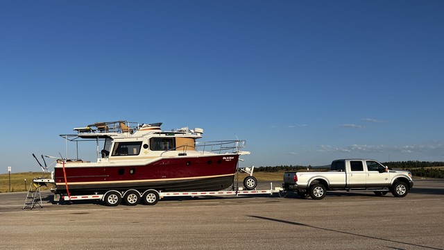 Photo of a relatively large boat on a trailer behind a large pick up truck. It’s the boat and trailer that need to go into the “rv garage.” The truck has another spot in the garage.

This photo copyright 2024 by Maria Langer. All rights reserved. Neither this image nor the accompanying alt text may be used to train AI systems.