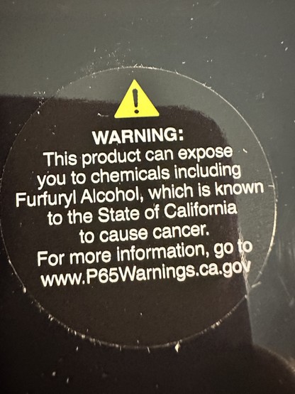 Warning label on a hair product that says “This product can expose you to chemicals including Furfuryl Alchol, which in known to the State of California to cause cancer. For more information, go to www.P65Warnings.ca.gov