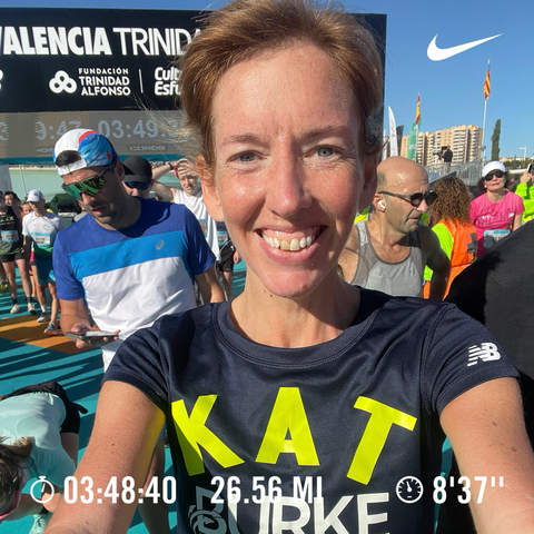 A smiling selfie of a woman named Kat after finishing the Valencia Marathon