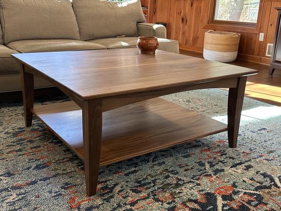 42” square walnut coffee table in a cozy den