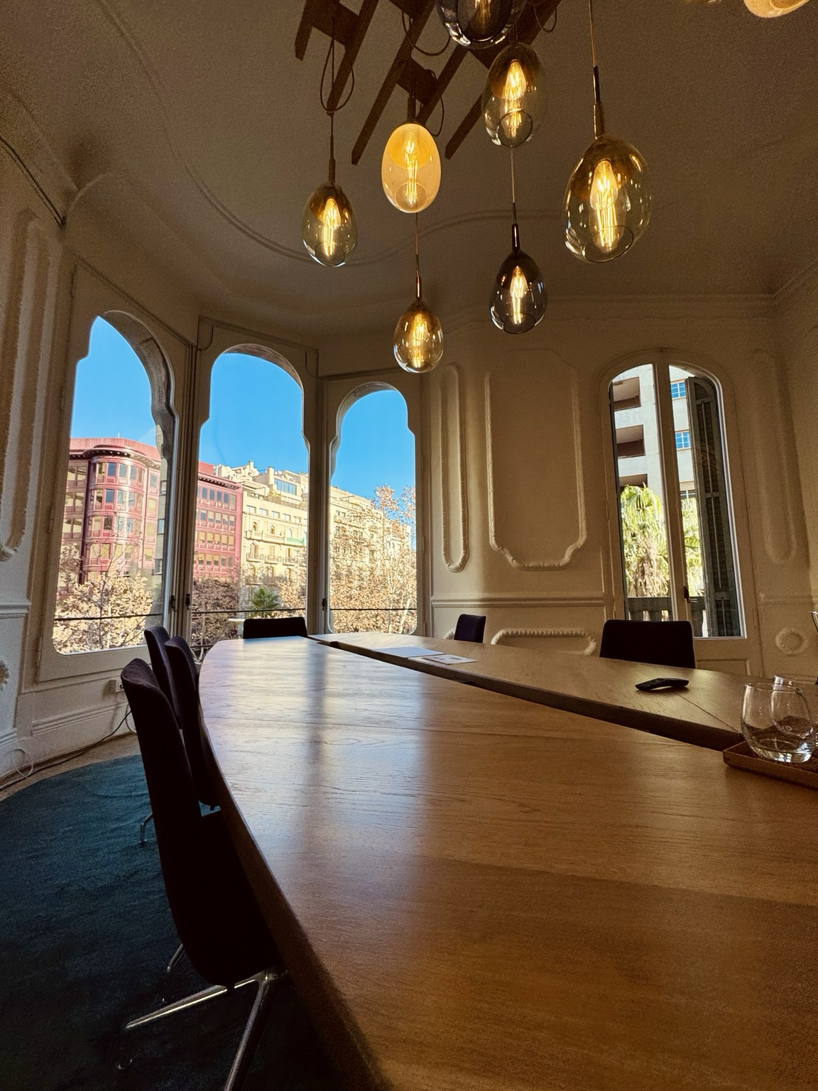 Corner conference room with huge floor-to-ceiling windows and lots of natural light, Modernist style 