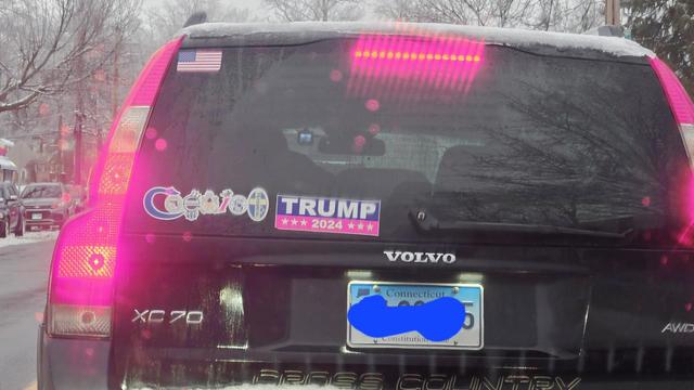 Coexist and Trump 2024 bumper sticker on the same car