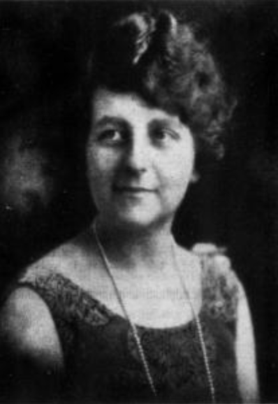 Constance Eberhart from a 1927 publication; a white woman with dark curly hair, wearing a sleeveless dress