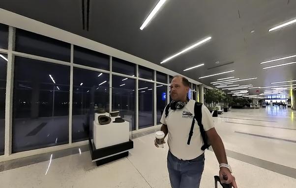 author in the airport at 5am with coffee
