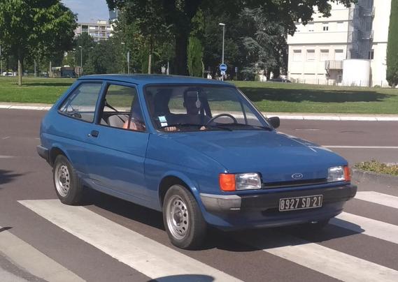 A blue 1985 Ford Fiesta with European license plates.